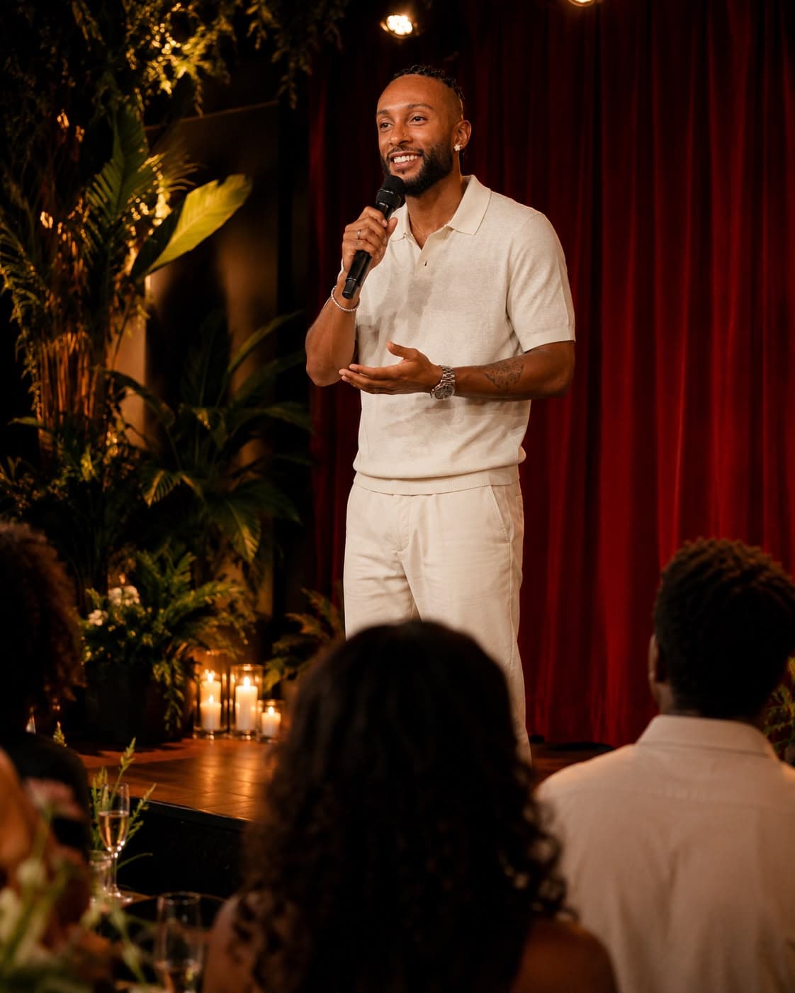 Host speaking to guests on stage